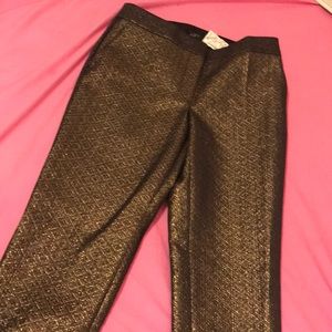 A loft pant is gold with a black and gold its new